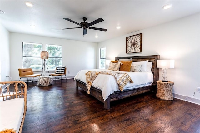 bedroom with ceiling fan and dark hardwood / wood-style flooring