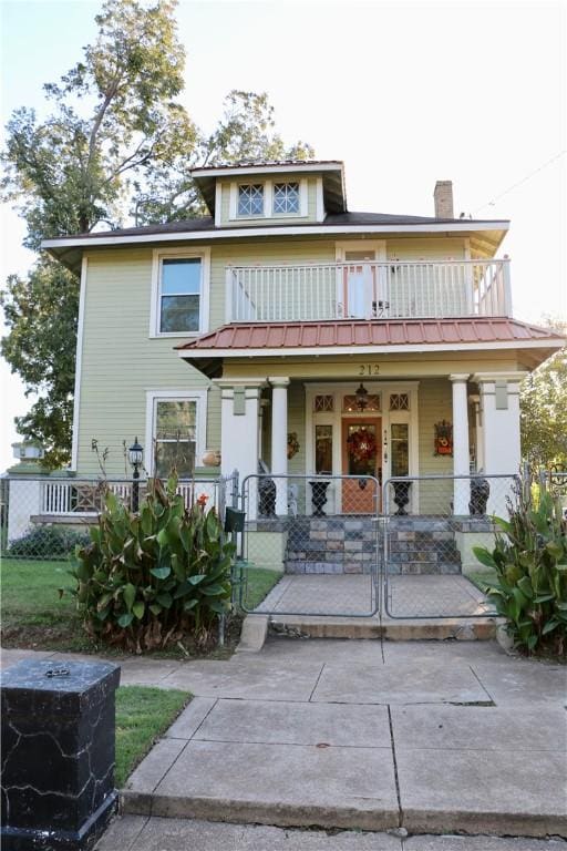 view of front of home with a porch and a balcony