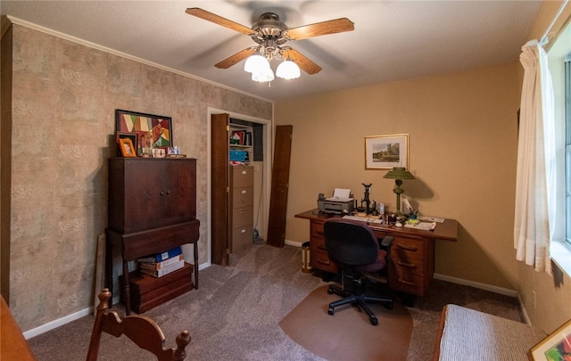 carpeted office featuring ceiling fan and ornamental molding