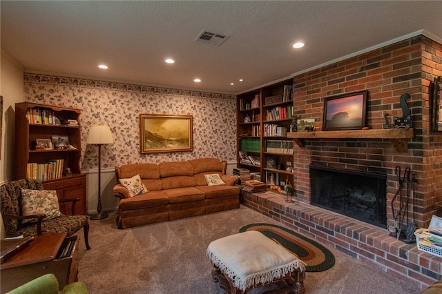 carpeted living room featuring ornamental molding, a textured ceiling, and a brick fireplace