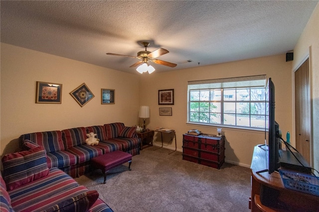 living room with carpet flooring, ceiling fan, and a textured ceiling