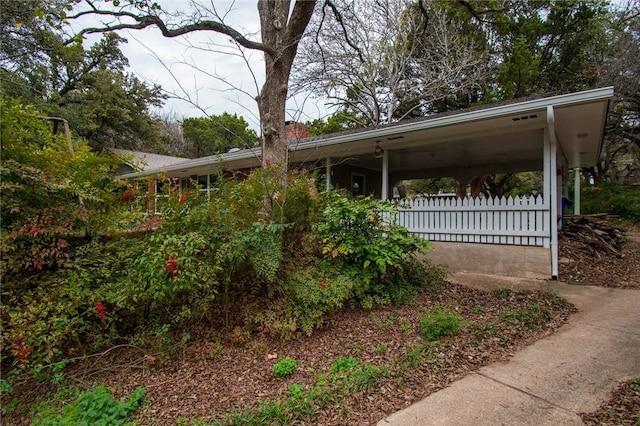 exterior space featuring a carport