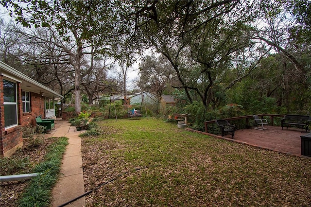 view of yard featuring a wooden deck