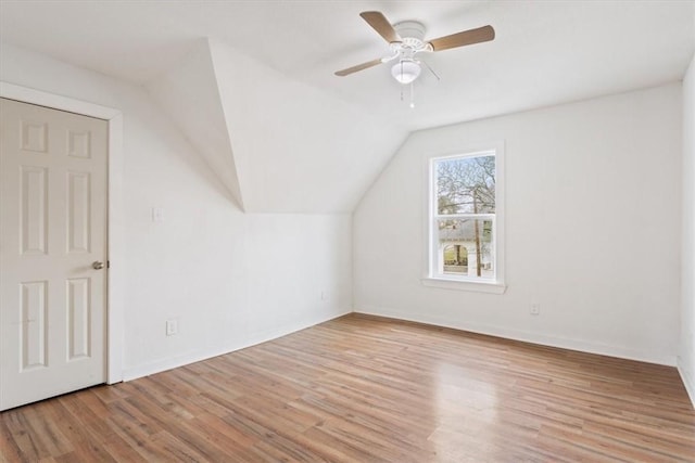 additional living space featuring ceiling fan, light hardwood / wood-style floors, and lofted ceiling