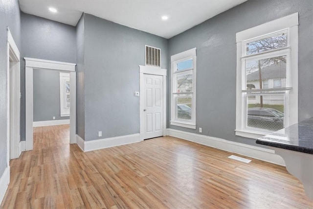 foyer entrance with light wood-type flooring