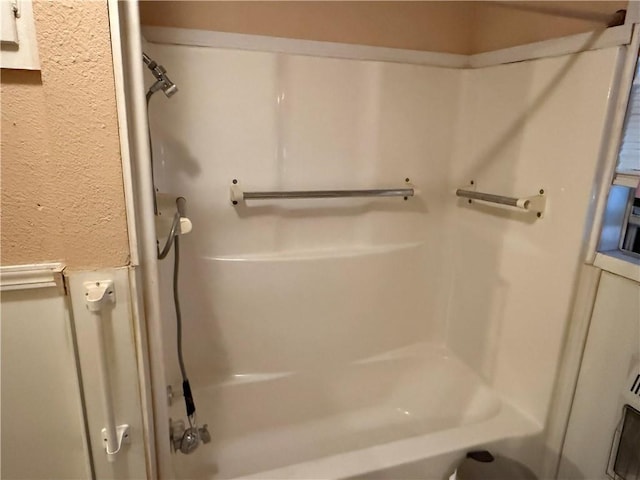 bathroom with shower / tub combination