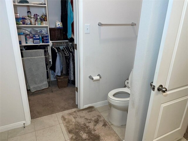 bathroom featuring tile patterned floors and toilet