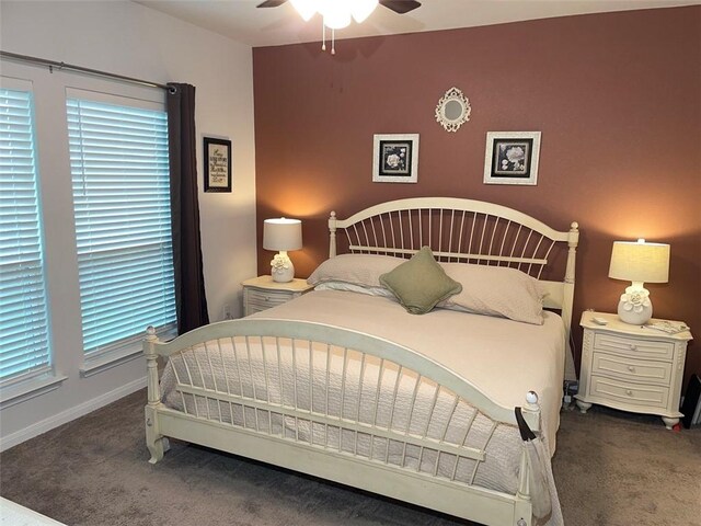 bedroom with dark carpet and ceiling fan