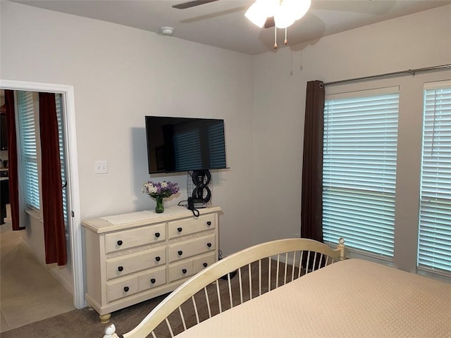 bedroom featuring ceiling fan and carpet floors