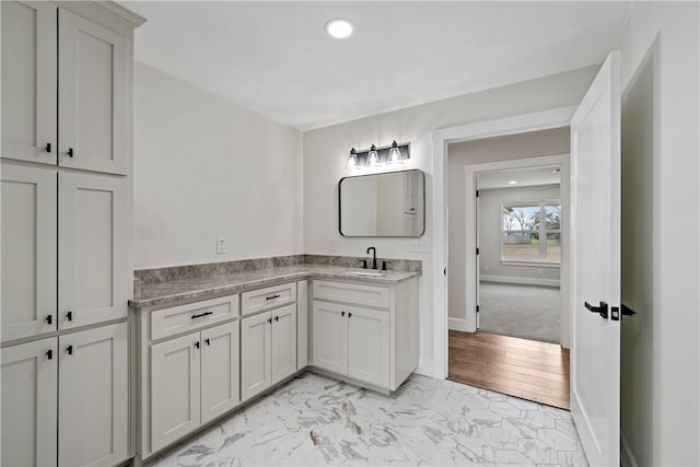 bathroom with vanity and wood-type flooring