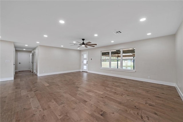 unfurnished living room with hardwood / wood-style floors and ceiling fan