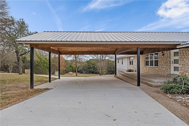 view of vehicle parking with a carport