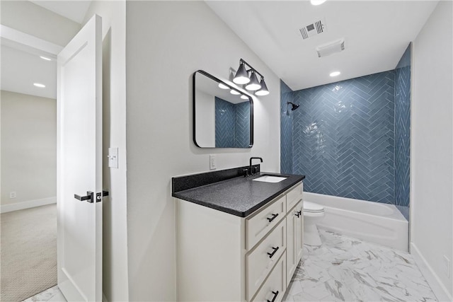 full bathroom with vanity, toilet, and tiled shower / bath