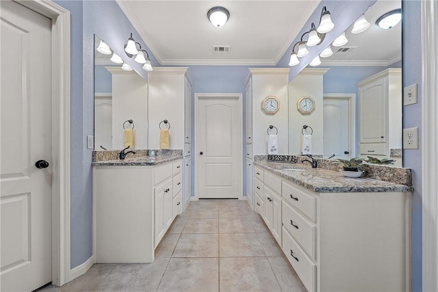 bathroom featuring ornamental molding, vanity, and tile patterned floors