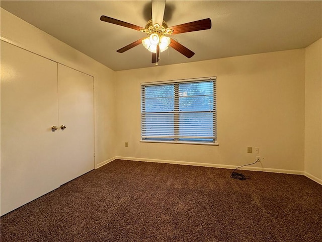 spare room featuring carpet flooring and ceiling fan