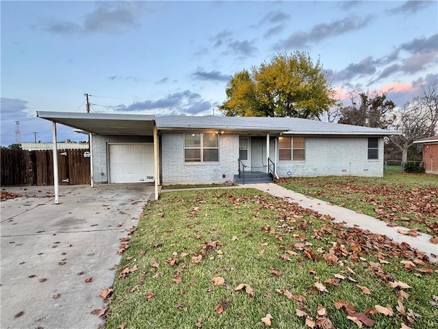 single story home featuring a front lawn, a garage, and a carport