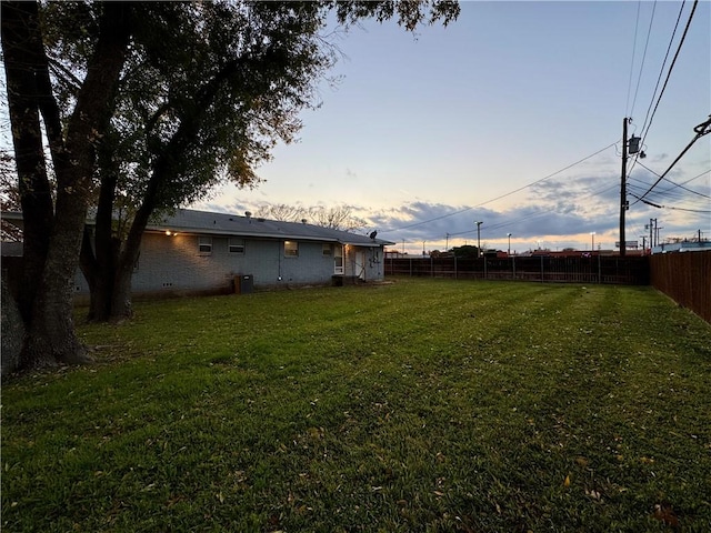 view of yard at dusk