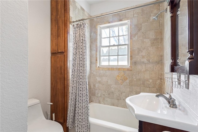 full bathroom featuring vanity, toilet, and shower / tub combo