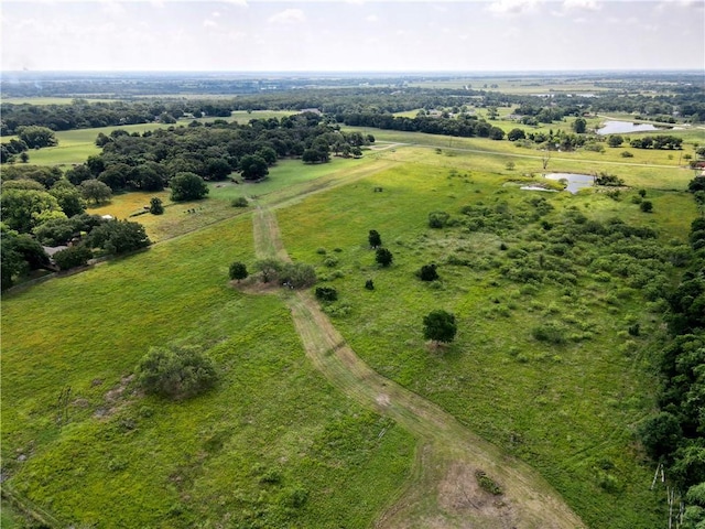 birds eye view of property featuring a rural view