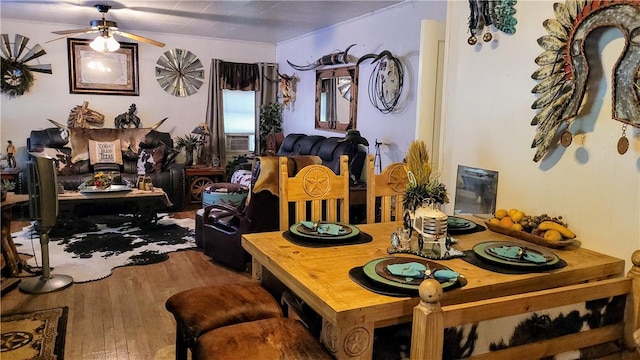 dining room featuring ceiling fan and wood-type flooring