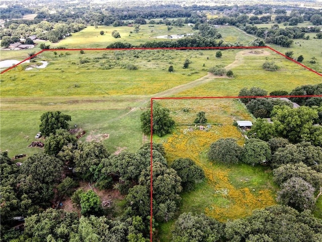 birds eye view of property featuring a rural view