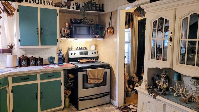 kitchen with stainless steel appliances, tasteful backsplash, and green cabinets