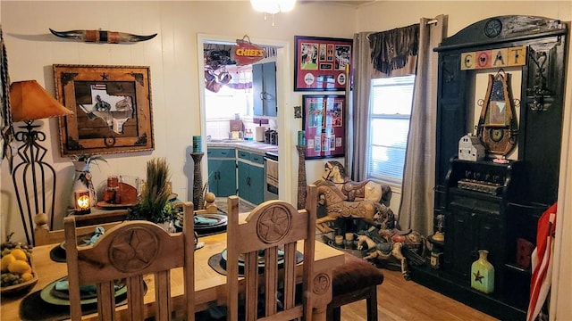 dining area with light hardwood / wood-style floors