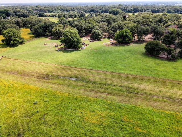 birds eye view of property with a rural view