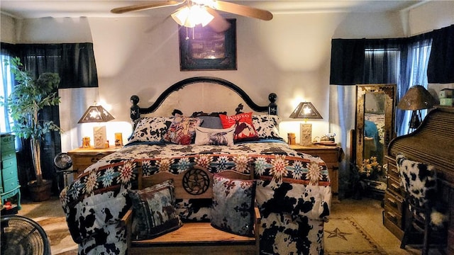 carpeted bedroom featuring ceiling fan