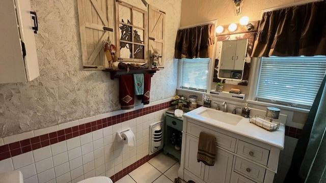 bathroom featuring tile patterned floors and vanity