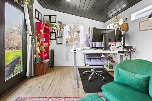 office space featuring lofted ceiling, light wood-type flooring, a wealth of natural light, and wood ceiling