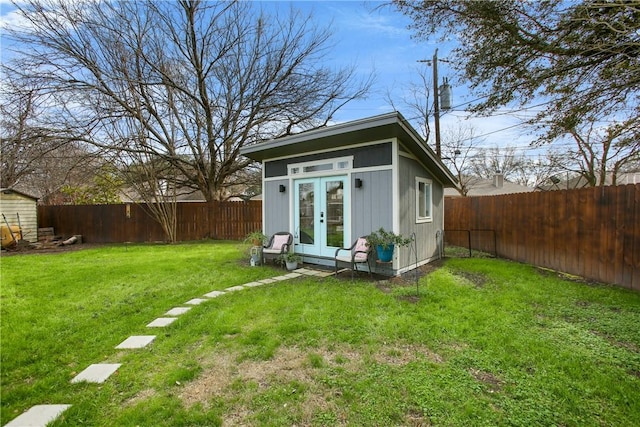 view of outbuilding featuring a lawn