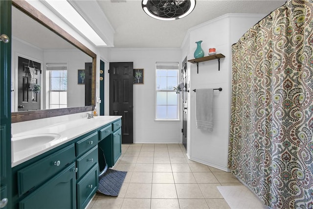 bathroom featuring crown molding, vanity, tile patterned flooring, and a textured ceiling