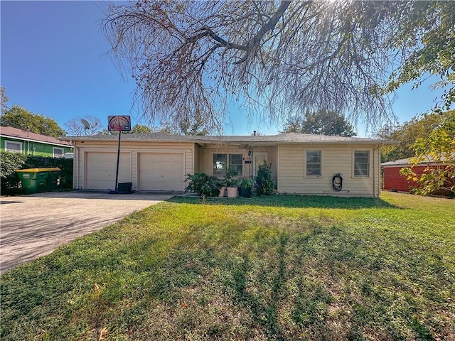 single story home featuring a garage and a front lawn