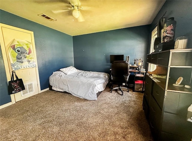 bedroom featuring ceiling fan and carpet