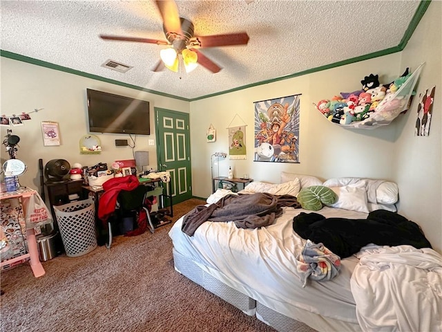 bedroom featuring carpet, a textured ceiling, ceiling fan, and ornamental molding