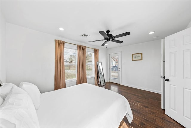 bedroom featuring baseboards, dark wood-style flooring, visible vents, and recessed lighting