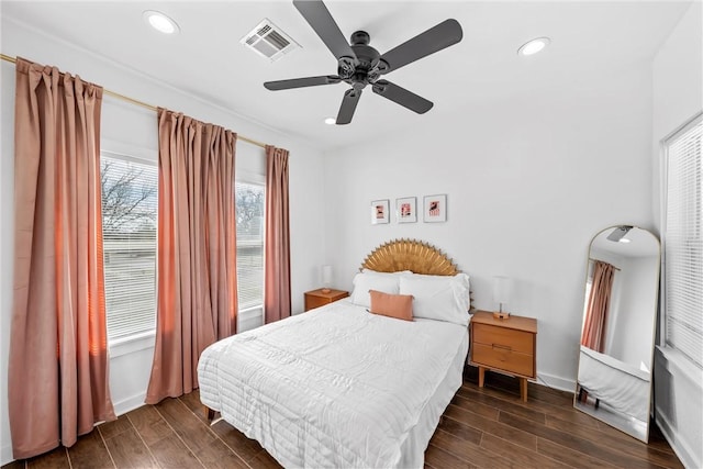 bedroom with ceiling fan, recessed lighting, wood finish floors, visible vents, and baseboards