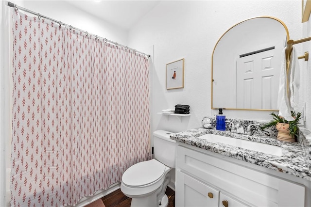 full bathroom with toilet, a shower with curtain, wood finished floors, and vanity