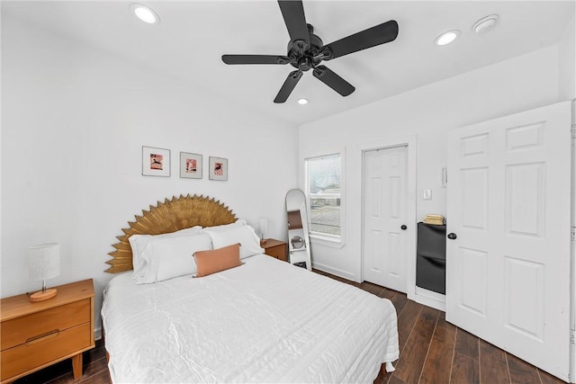 bedroom with dark wood-style floors, baseboards, a ceiling fan, and recessed lighting