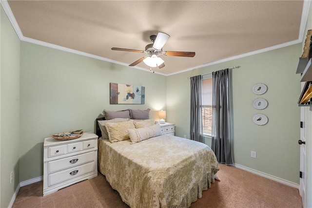 carpeted bedroom featuring ceiling fan and ornamental molding