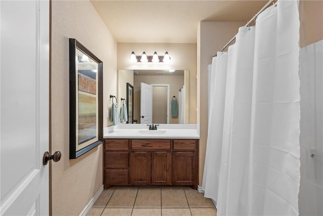 bathroom featuring tile patterned floors and vanity