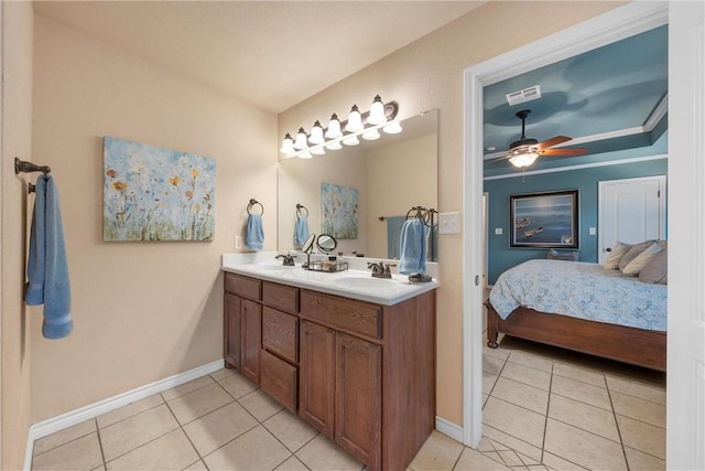 bathroom with tile patterned flooring, vanity, and ceiling fan