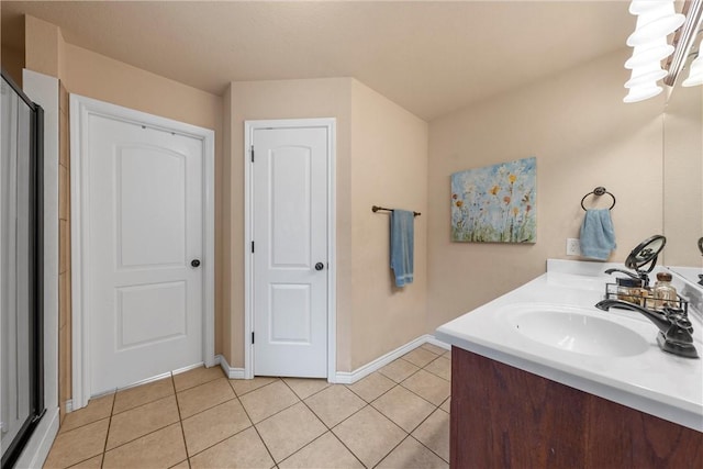 bathroom featuring tile patterned flooring and vanity