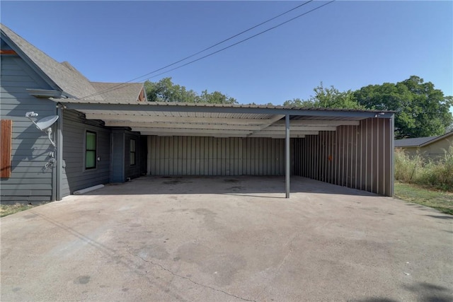 view of vehicle parking with a carport