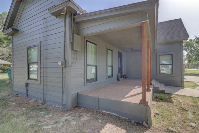 view of side of property with a porch