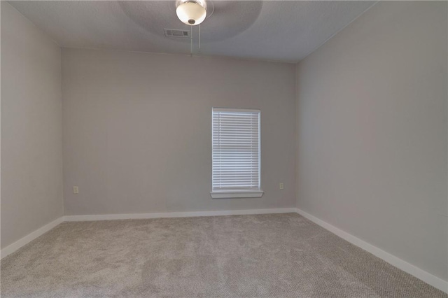 empty room with light colored carpet