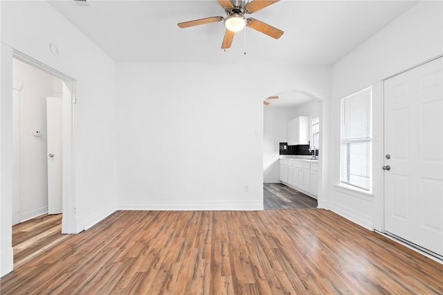 interior space featuring hardwood / wood-style flooring and ceiling fan