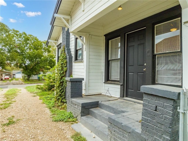 doorway to property with a porch