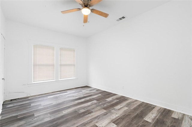 spare room featuring hardwood / wood-style floors and ceiling fan